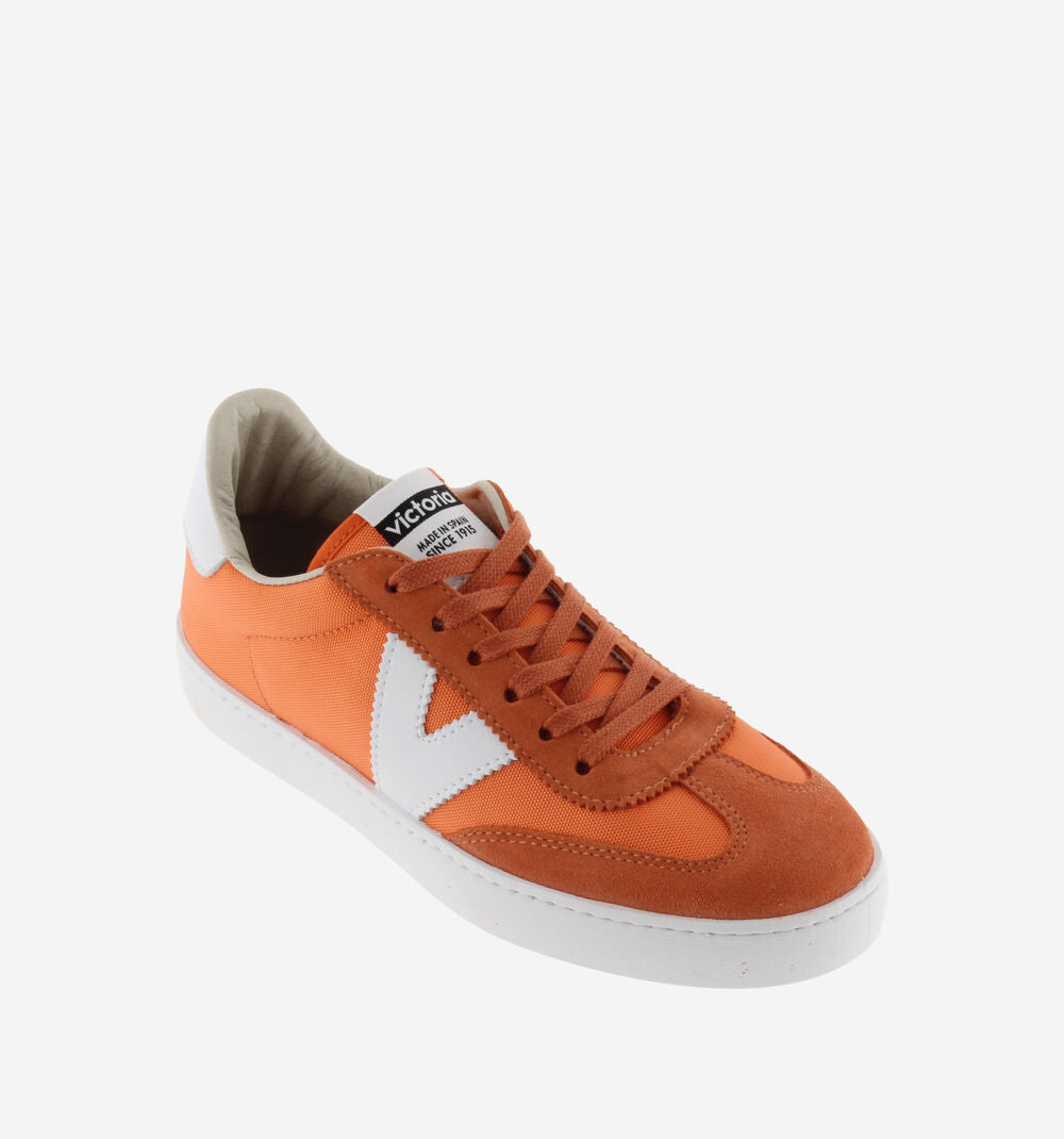 ORange and white nylon and suede trainers