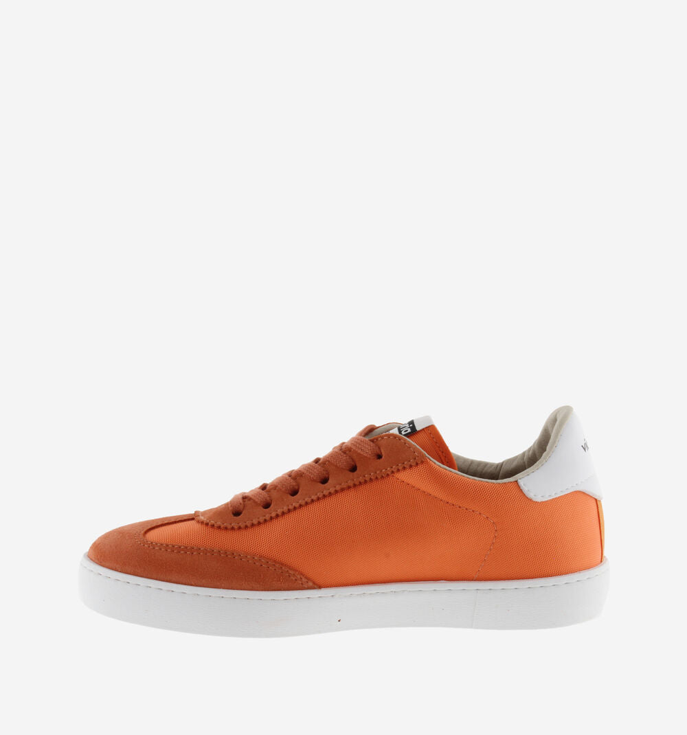 ORange and white nylon and suede trainers