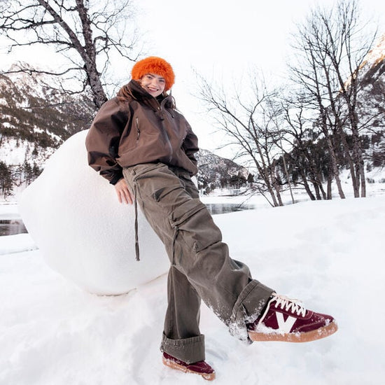 burgundy trainers with white v and rear with white laces model shot