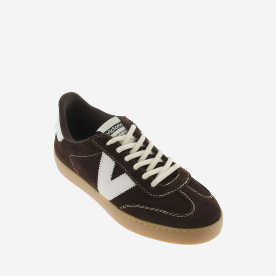 chocolate brown suede trainers with white back and v with off white laces birds eye view 