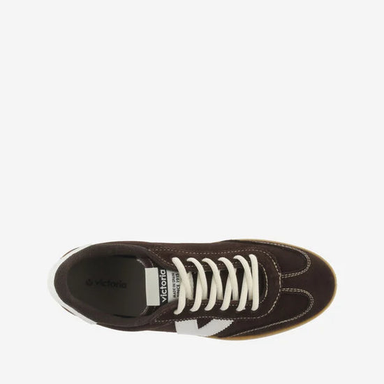 chocolate brown suede trainers with white back and v with off white laces  birds eye view