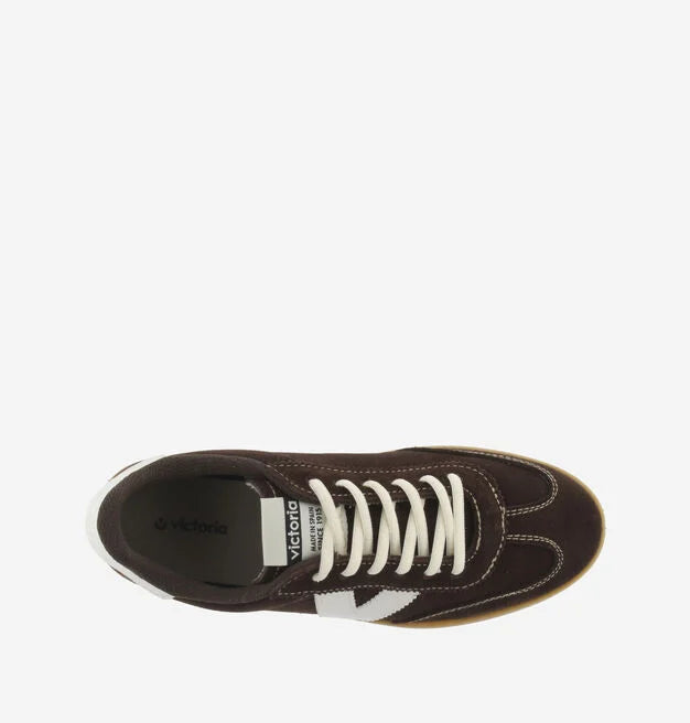 chocolate brown suede trainers with white back and v with off white laces  birds eye view