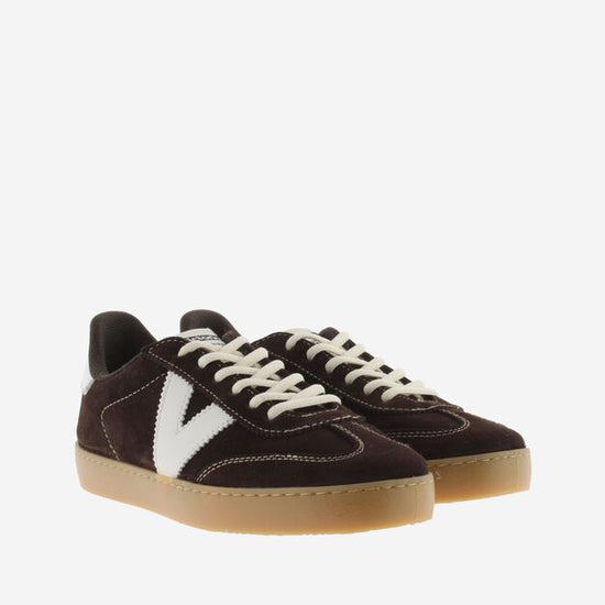 chocolate brown suede trainers with white back and v with off white laces  front view 
