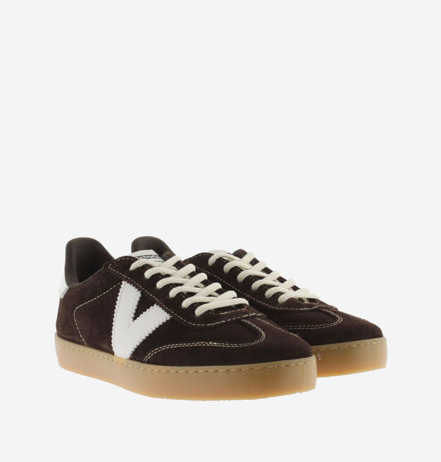 chocolate brown suede trainers with white back and v with off white laces  front view 