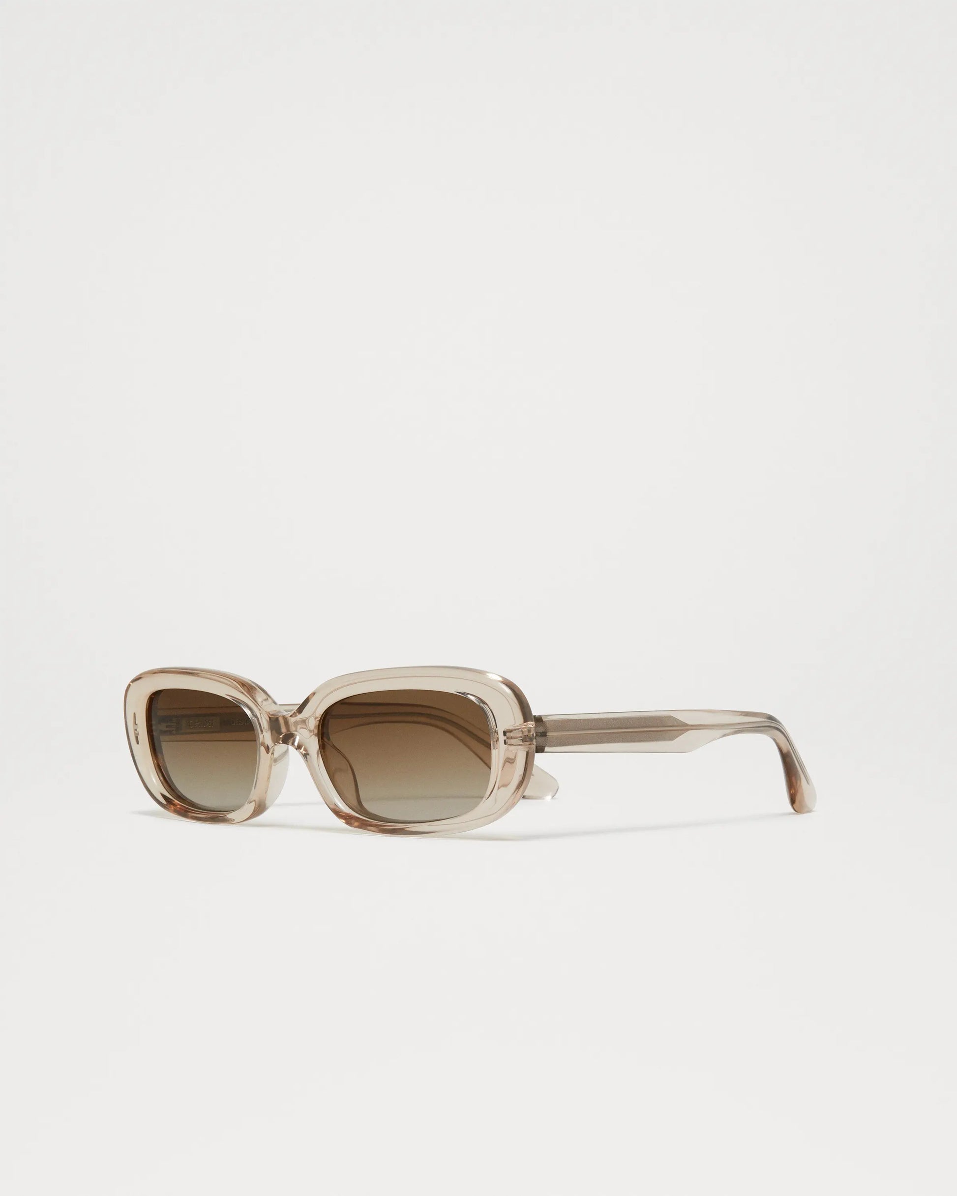 Ecru acetate soft edged rectangular sunglasses with a brown lense