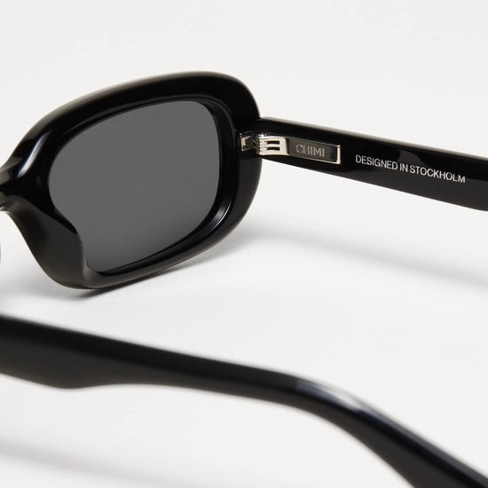 Black rectangular framed sunglasses