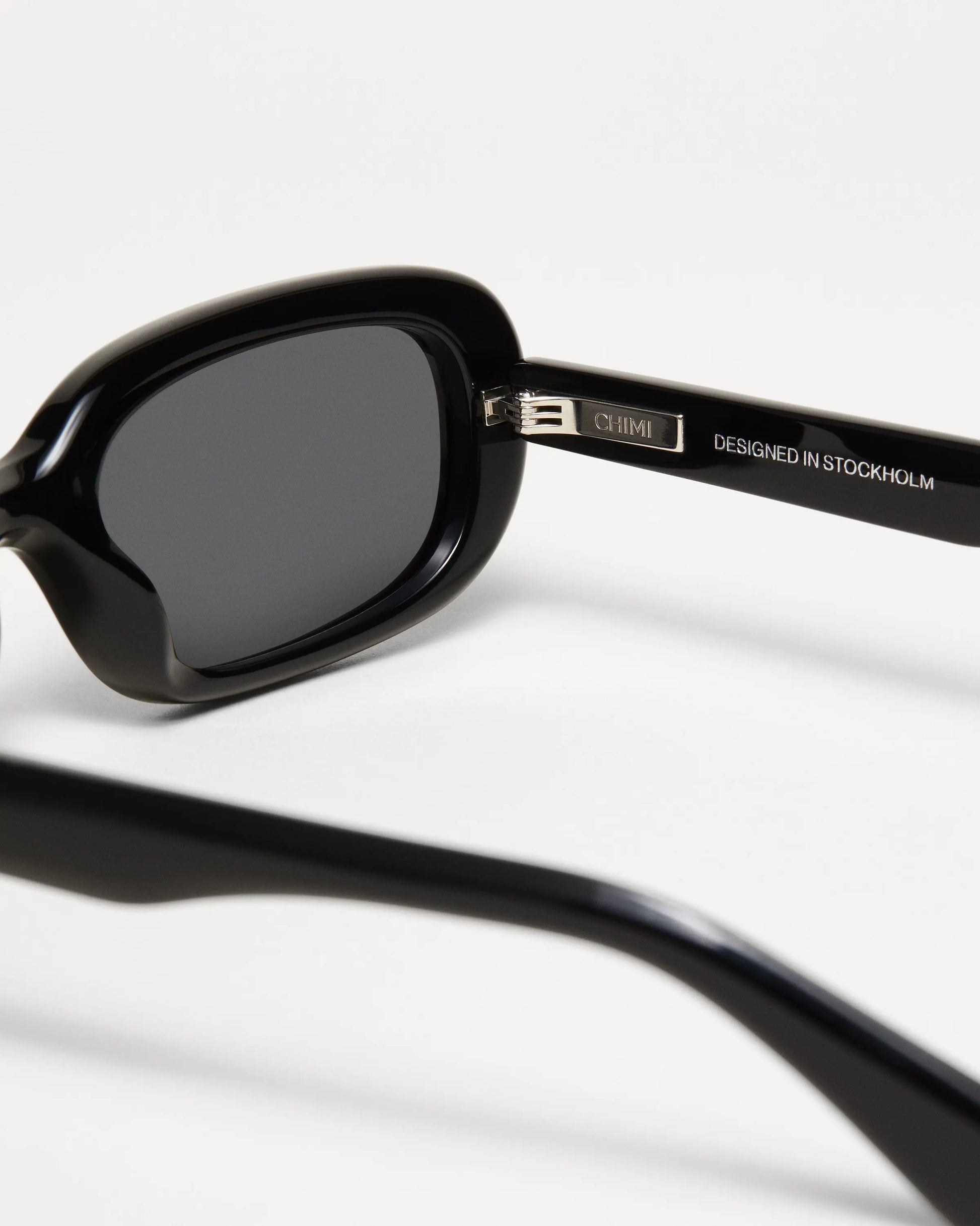 Black rectangular framed sunglasses