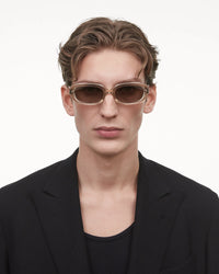 Ecru acetate soft edged rectangular sunglasses with a brown lense