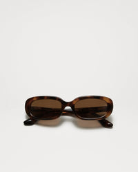 Tortoise shell oval frame in Italian acetate with a brown lense
