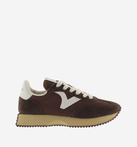 chocolate brown trainers with white v and serrated tread