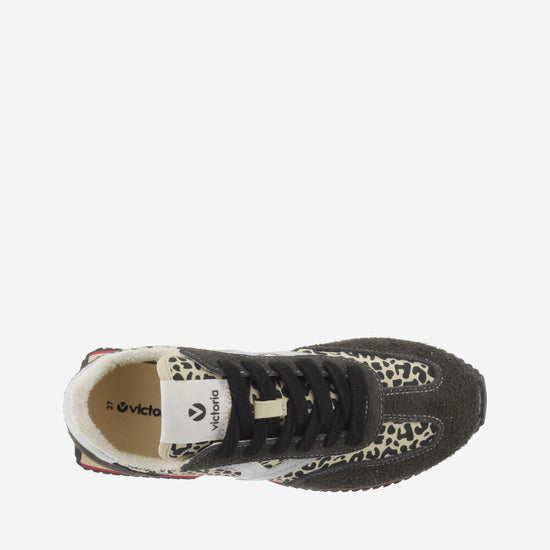 black trainers with silver v, animal print and black laces with fleece interior birds eye view