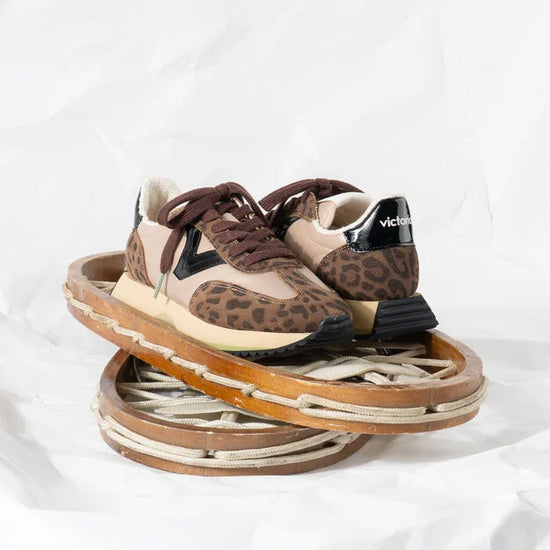 chocolate brown trainers with fleece interior, leopard print, black v and brown laces 