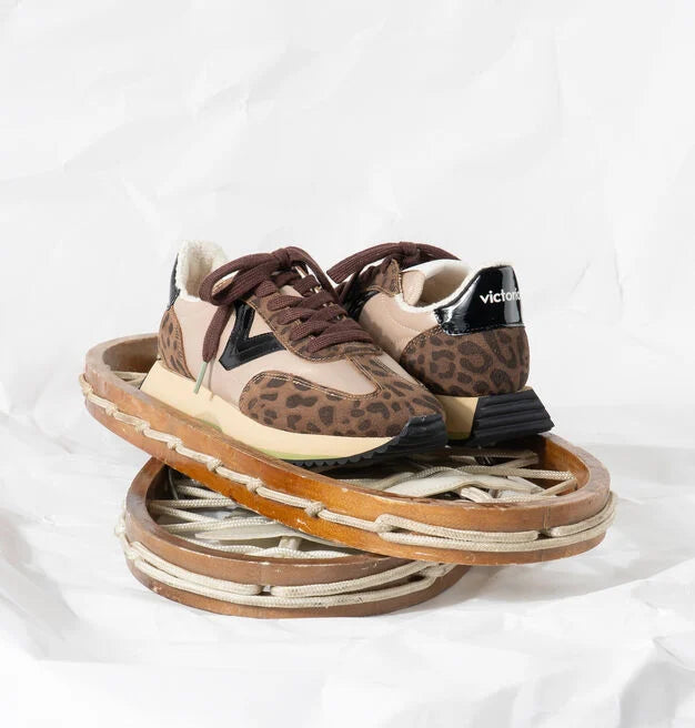 chocolate brown trainers with fleece interior, leopard print, black v and brown laces 