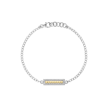 Silver bracelet with a gold bar charm on a white background from Anna Beck