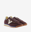 burgundy baseball style trainers with blue back, white v and a serrated tread front view 