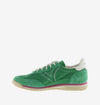 green suede trainers with white laces and serrated tread and pink edging side