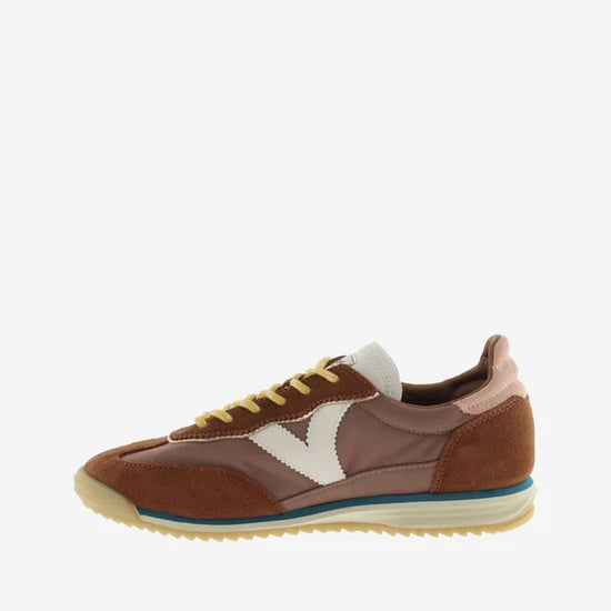 terracotta coloured suede trainers with cyclist toe and serrated tread side