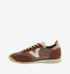 terracotta coloured suede trainers with cyclist toe and serrated tread side