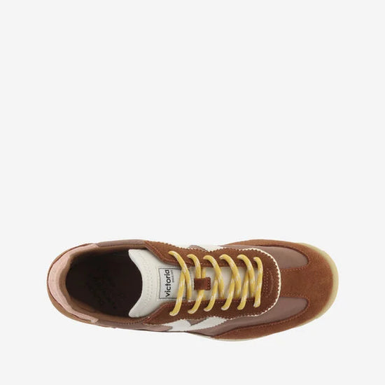 terracotta coloured suede trainers with cyclist toe and serrated tread birds eye view