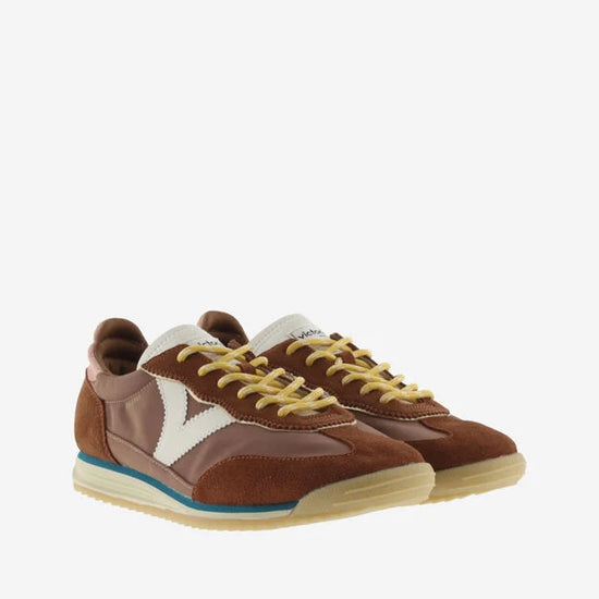 terracotta coloured suede trainers with cyclist toe and serrated tread side
