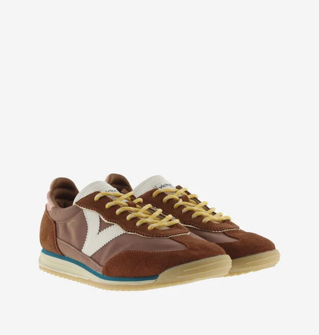terracotta coloured suede trainers with cyclist toe and serrated tread side