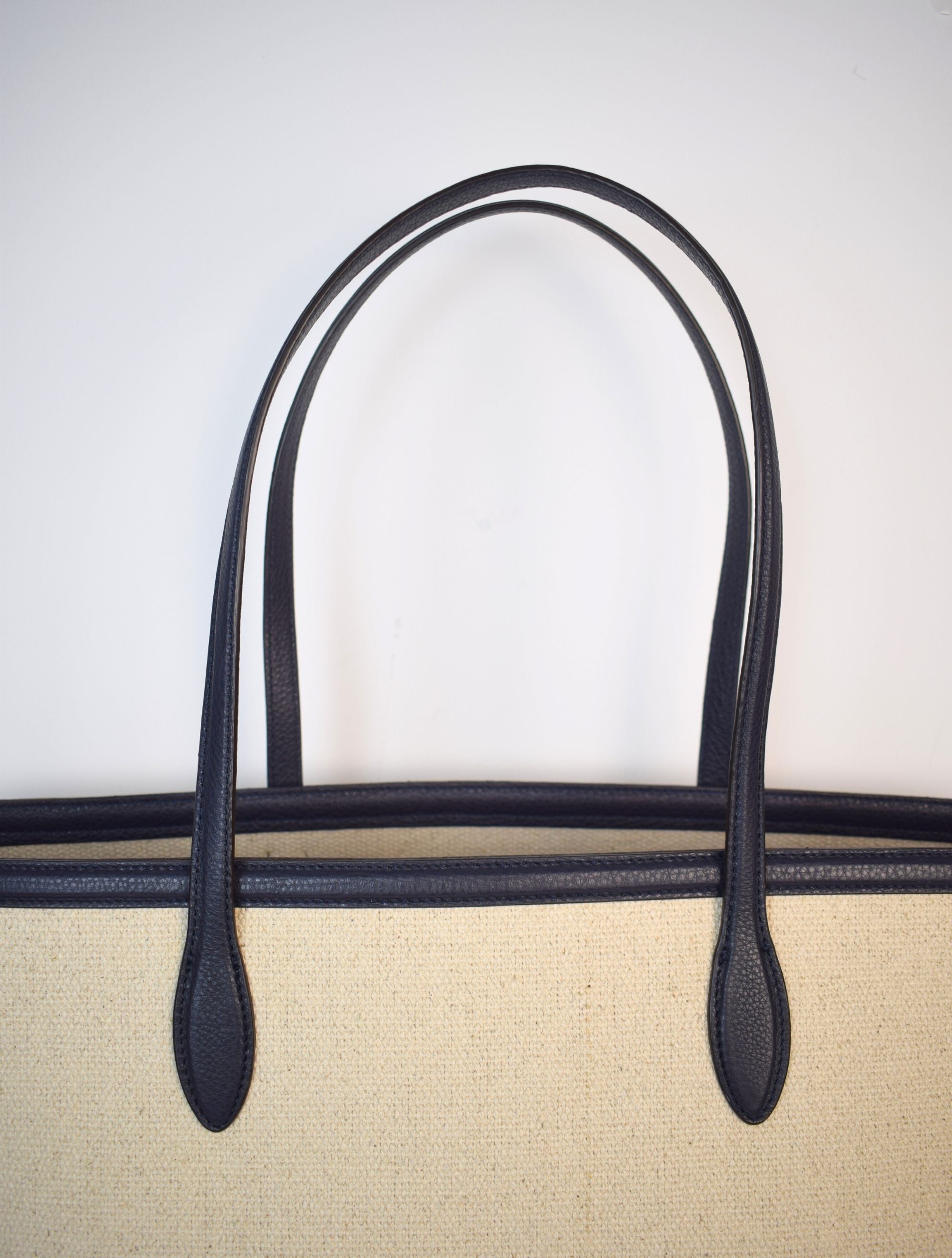 Natural fabric shopper with navy leather trim and internal zippable pouch pocket detail