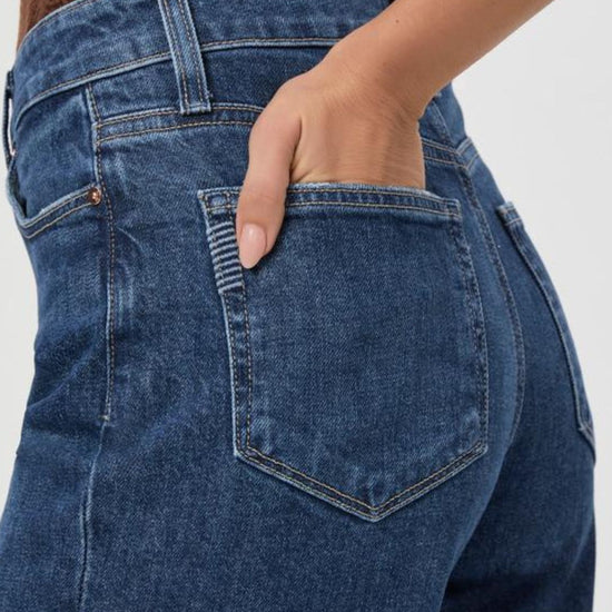 Rear pocket view of Anessa cropped jeans with distressed hem