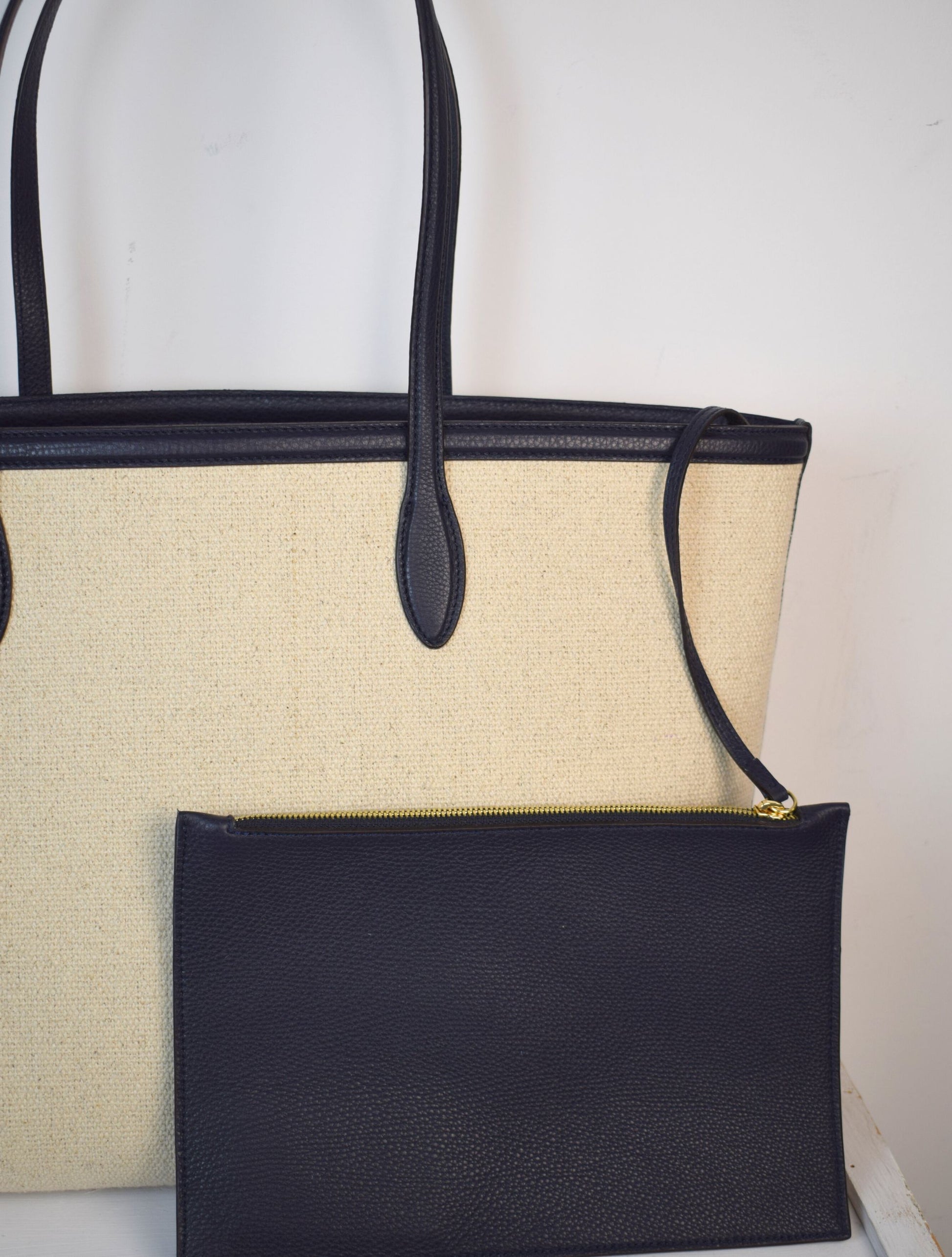 Natural fabric shopper with navy leather trim and internal zippable pouch pocket detail