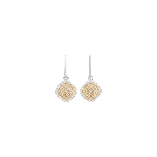 A pair of silver drop earrings with diamond-shaped pavé settings in yellow gold, shown on a plain white background.