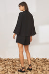 Mid weight button through notch neck wide sleeve black blouse