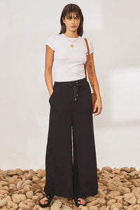 Black wide leg trousers with elasticated waistband and drawstring with crinkle fabric