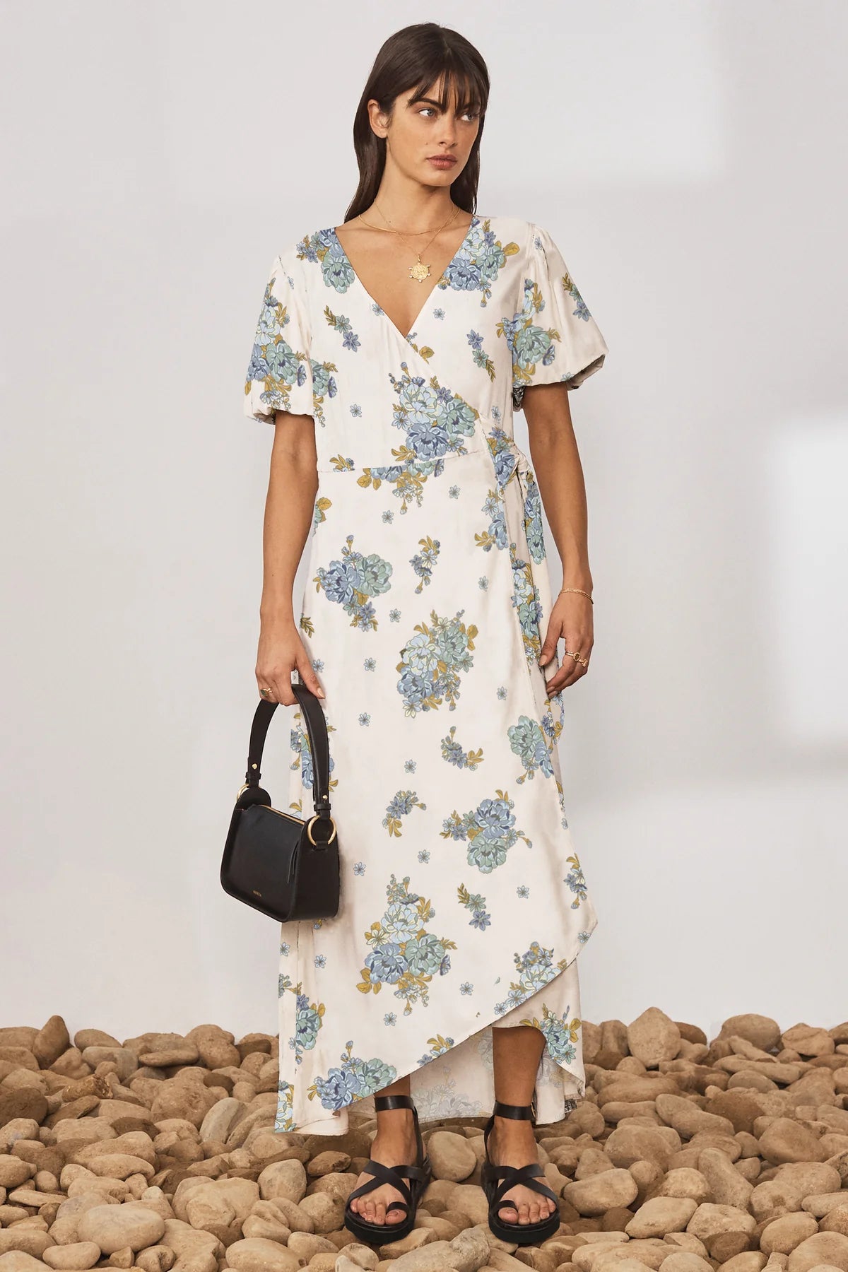 Cream V neck wrap dress with short puff sleeves and floral print