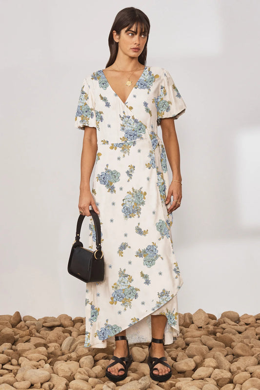 Cream V neck wrap dress with short puff sleeves and floral print