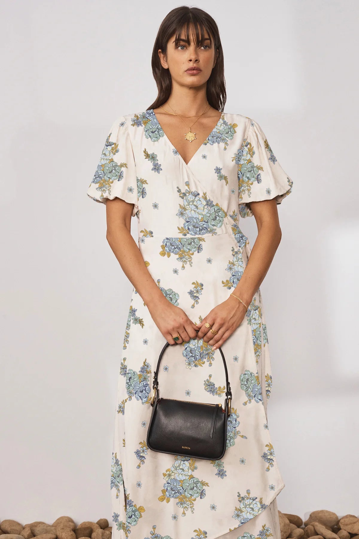 Cream V neck wrap dress with short puff sleeves and floral print