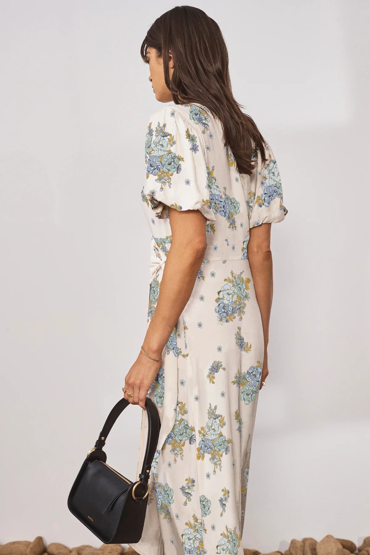 Cream V neck wrap dress with short puff sleeves and floral print