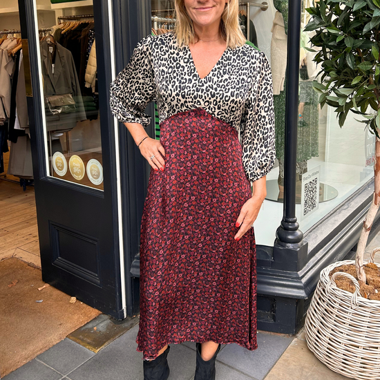 Contrast A line midi dress with red floral skirt and leopard print white and black V neck top