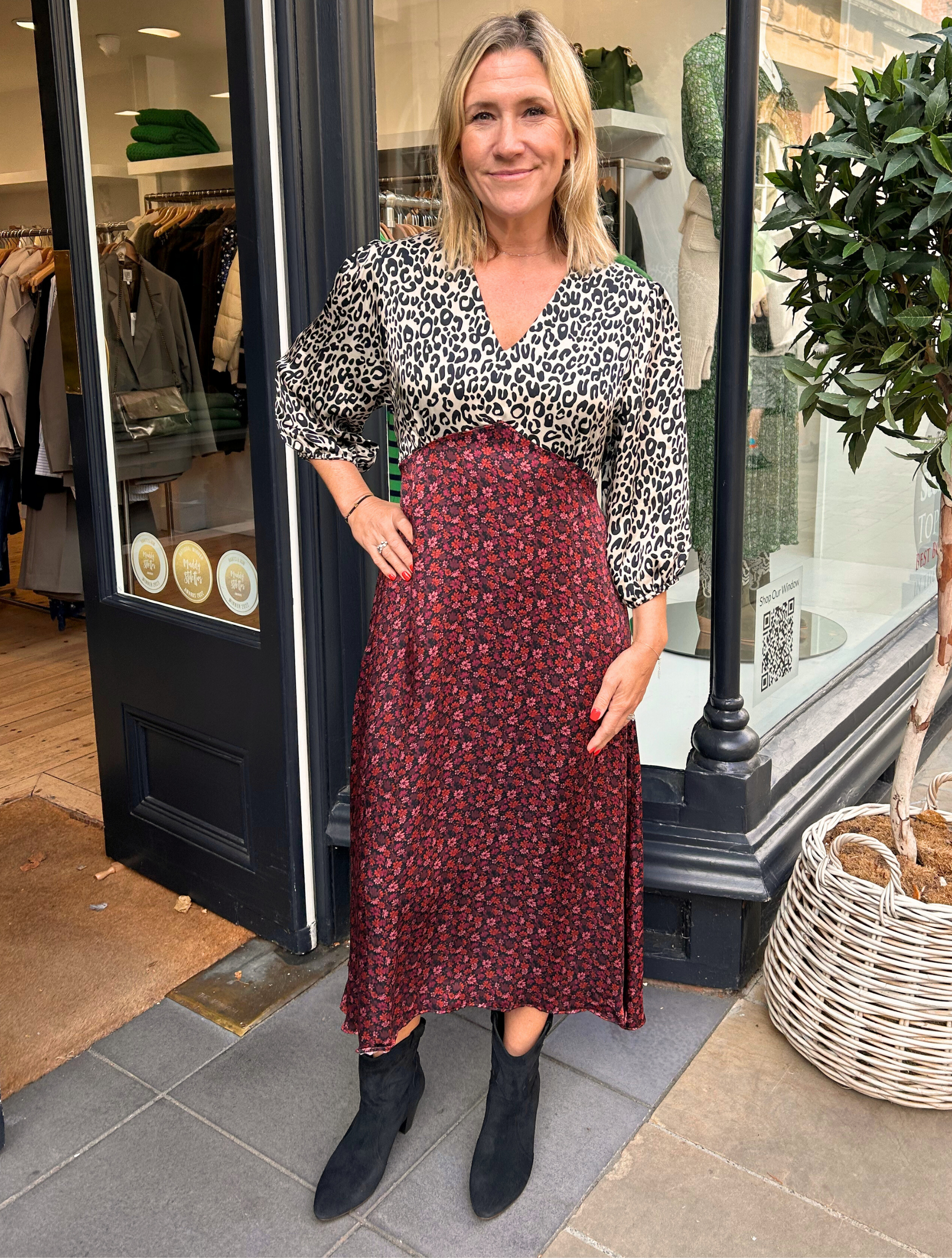 Contrast A line midi dress with red floral skirt and leopard print white and black V neck top