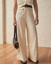 Cream linen wide leg trousers with two front patch pockets