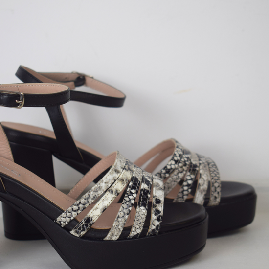 Black platform heel with snake skin straps 