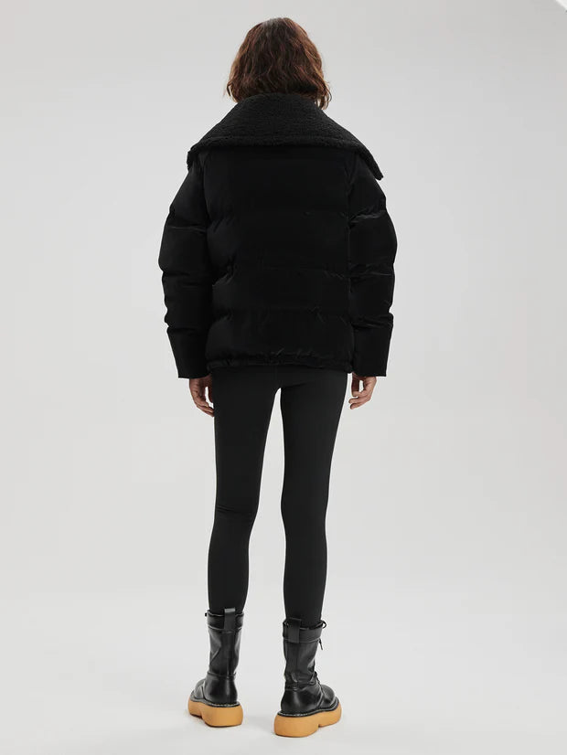 black oversized puffer with sherpa collar and 2 front flap pockets  rear view