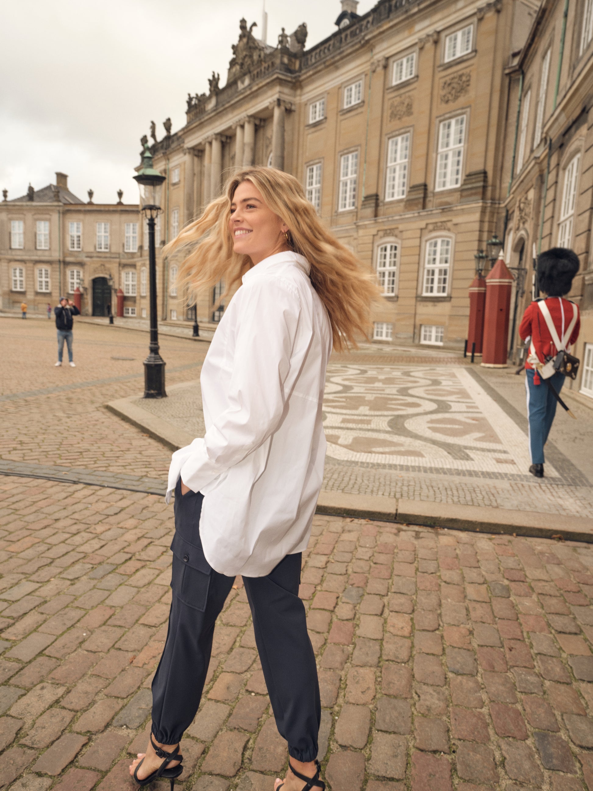white shirt with concealed placket, curved hem and classic collar model shot rear view