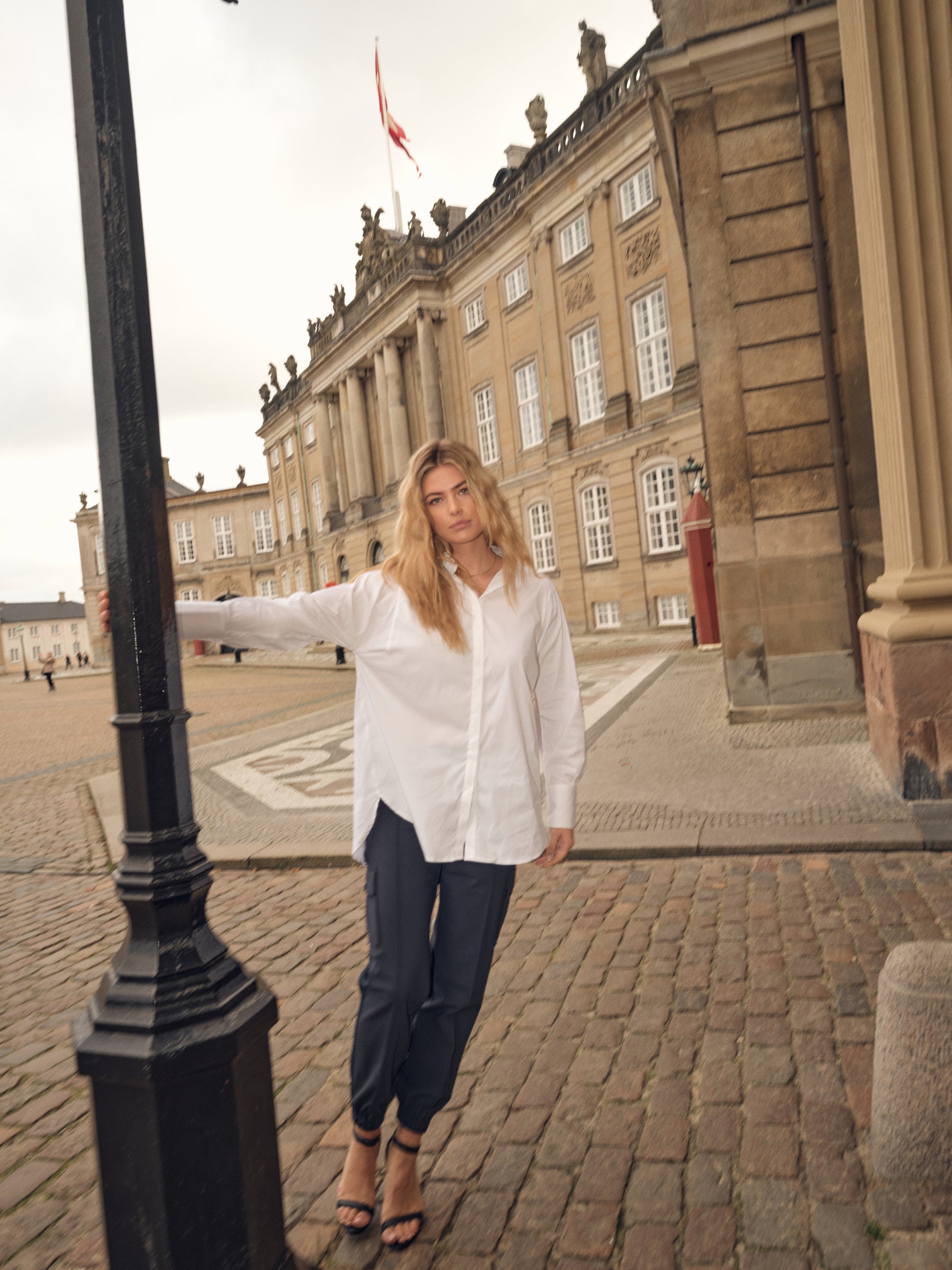 white shirt with concealed placket, curved hem and classic collar model shot