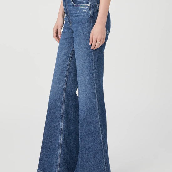 Medium blue high waist jeans with flared bottom side view