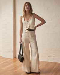 Cream cropped waistcoat with button fastening and two front patch pockets