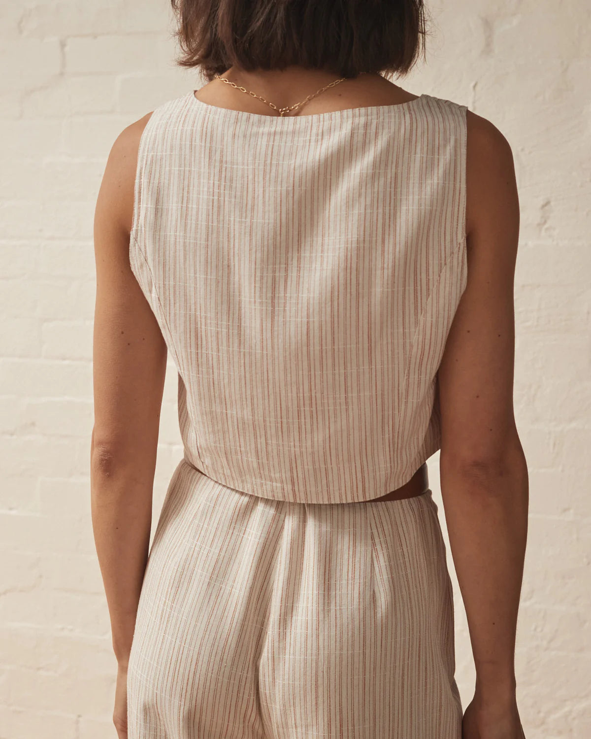 Cream stripped cropped waistcoat with button fastening and two front patch pockets