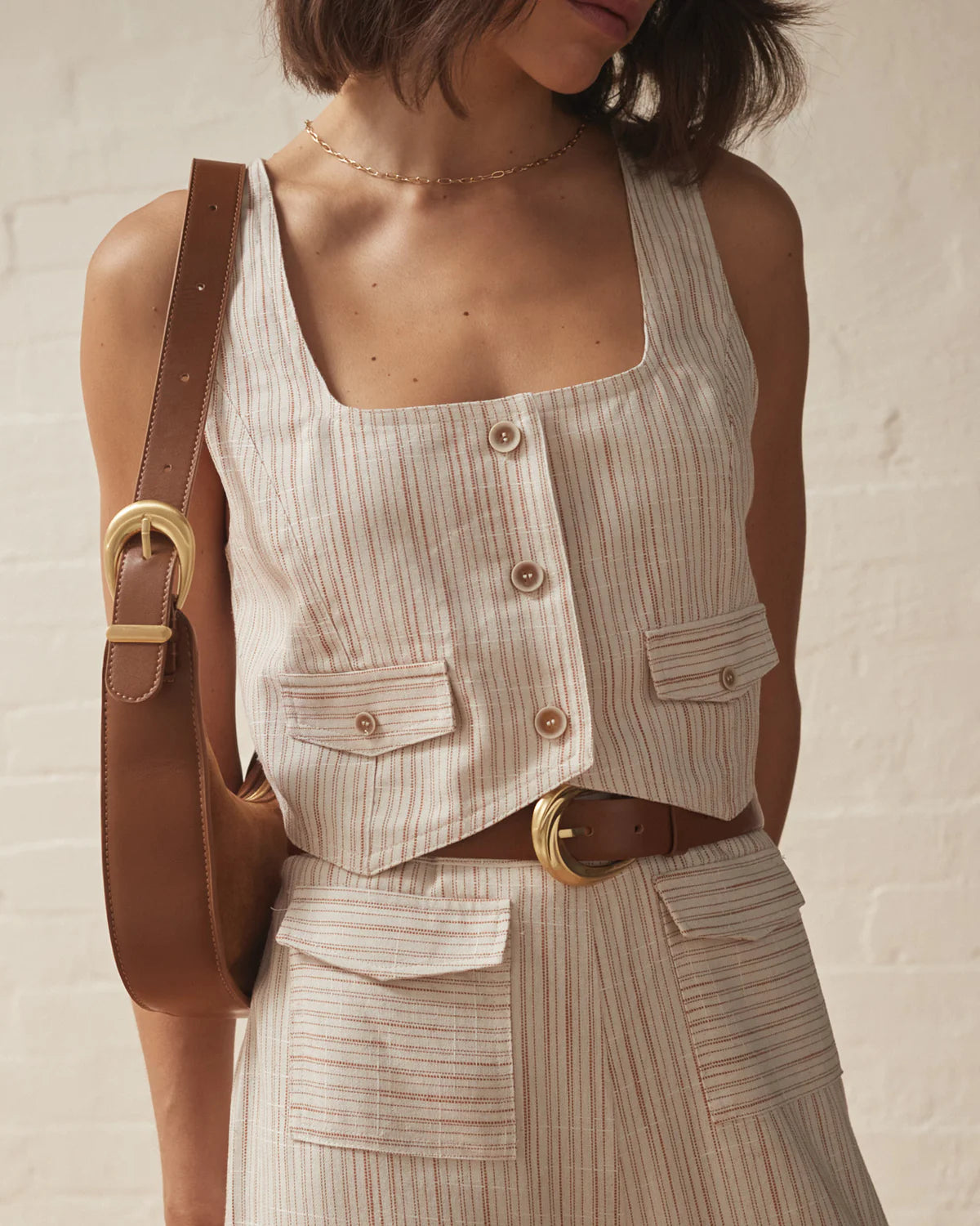 Cream stripped cropped waistcoat with button fastening and two front patch pockets