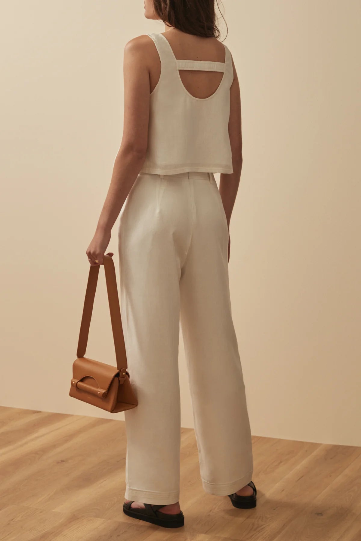 White linen trousers with patch pockets and top stitching