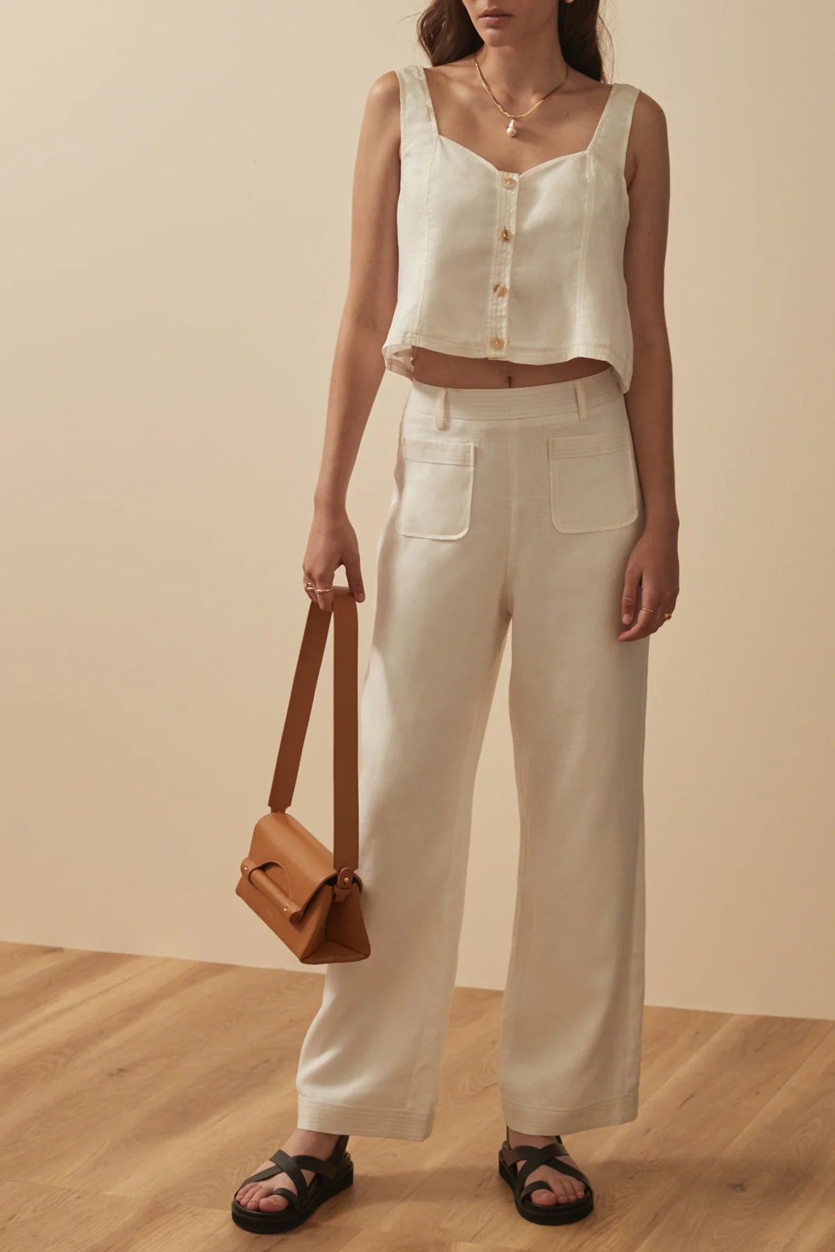 White linen trousers with patch pockets and top stitching