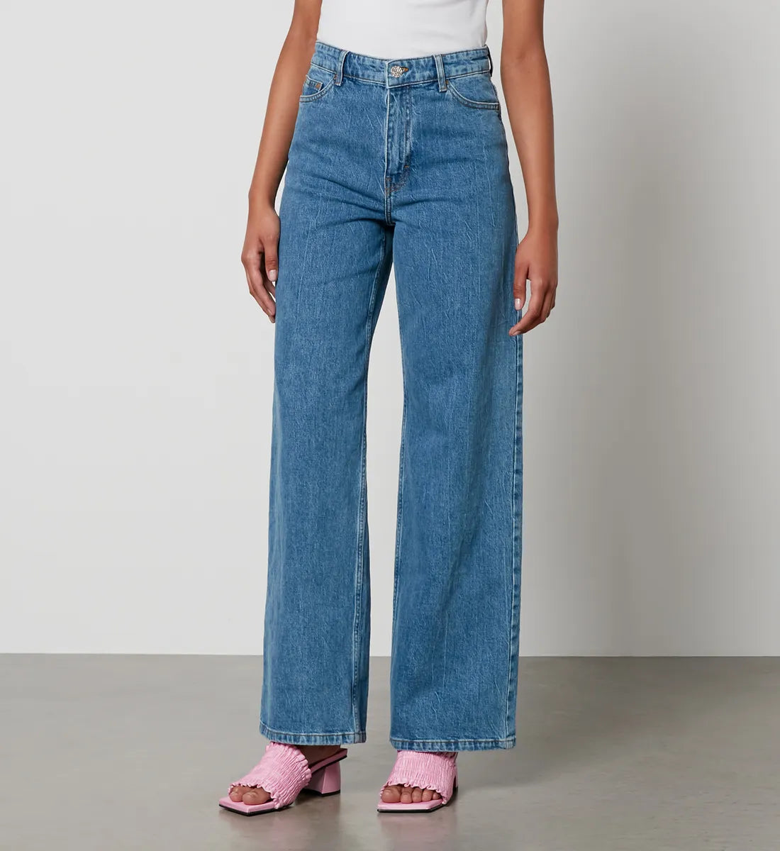 Straight leg mid blue high waisted jeans with zip fly and silver button fastening