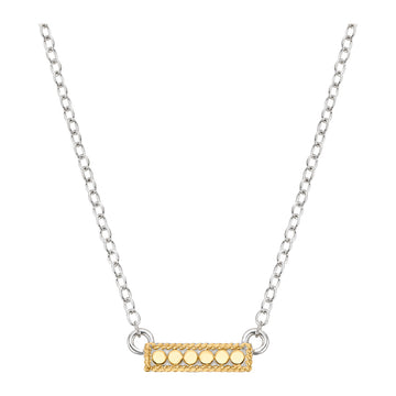 Necklace with a gold bar pendant on a white background